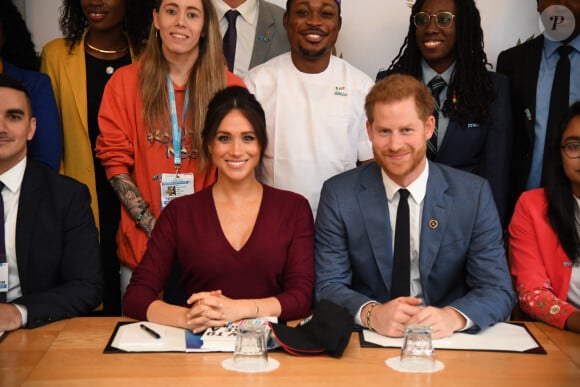 Le prince Harry, duc de Sussex, et Meghan Markle, duchesse de Sussex, participent à une réunion sur l'égalité des genres avec les membres du Queen's Commonwealth Trust (dont elle est vice-présidente) et du sommet One Young World au château de Windsor, 2019.