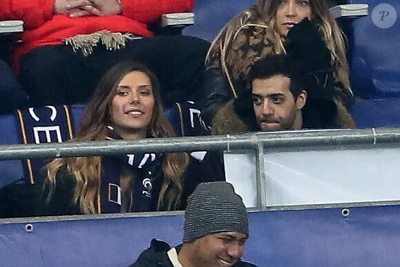 Exclusif - No Web - Camille Cerf et Tarek Boudali dans les tribunes du Stade de France lors du match de football amical France - Colombie (sont-ils vraiment que des amis ?) à Saint-Denis le 23 mars 2018.  