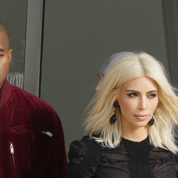 Kanye West et sa femme Kim Kardashian - People à la sortie du défilé de mode "Louis Vuitton", collection prêt-à-porter automne-hiver 2015/2016, à Paris.