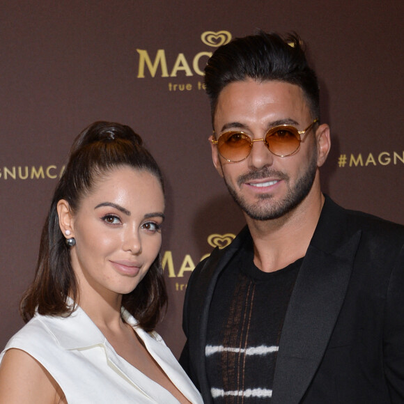 Nabilla Benattia (enceinte) et son mari Thomas Vergara au photocall de l'after party "Magnum x Rita Ora" sur la plage privée Magnum lors du 72ème Festival International du Film de Cannes, France,le 16 mai 2019. © Veeren/Bestimage 