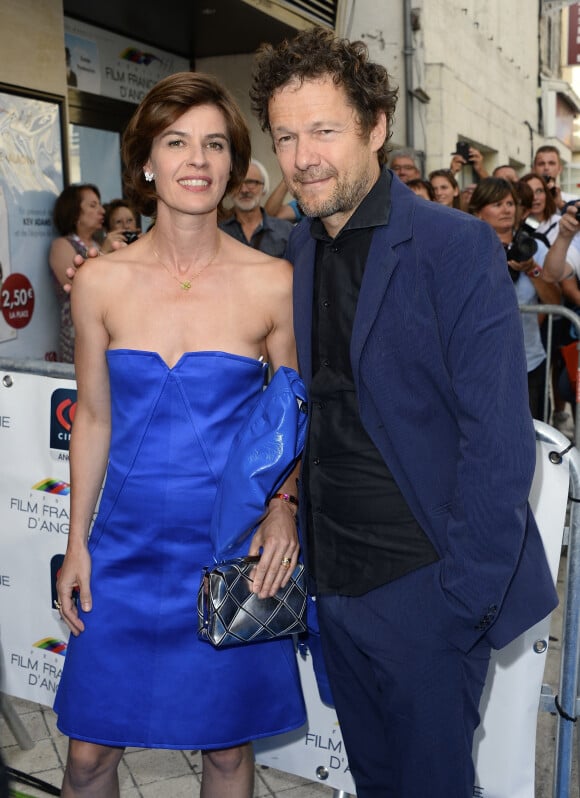 Irène Jacob (robe Courrèges et bijoux Van Cleef & Arpels) et son mari Jérôme Kircher - Première du film "Belles Familles" lors de la 8ème édition du Festival du film francophone d'Angoulême le 25 aout 2015.