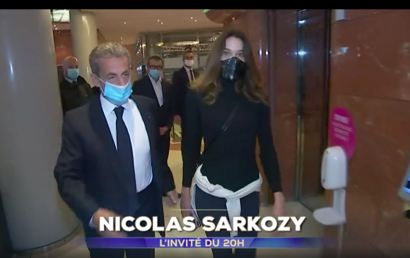 Nicolas Sarkozy accompagné par son épouse Carla Bruni-Sarkozy dans les locaux de TF1, avant le JT de 20H.