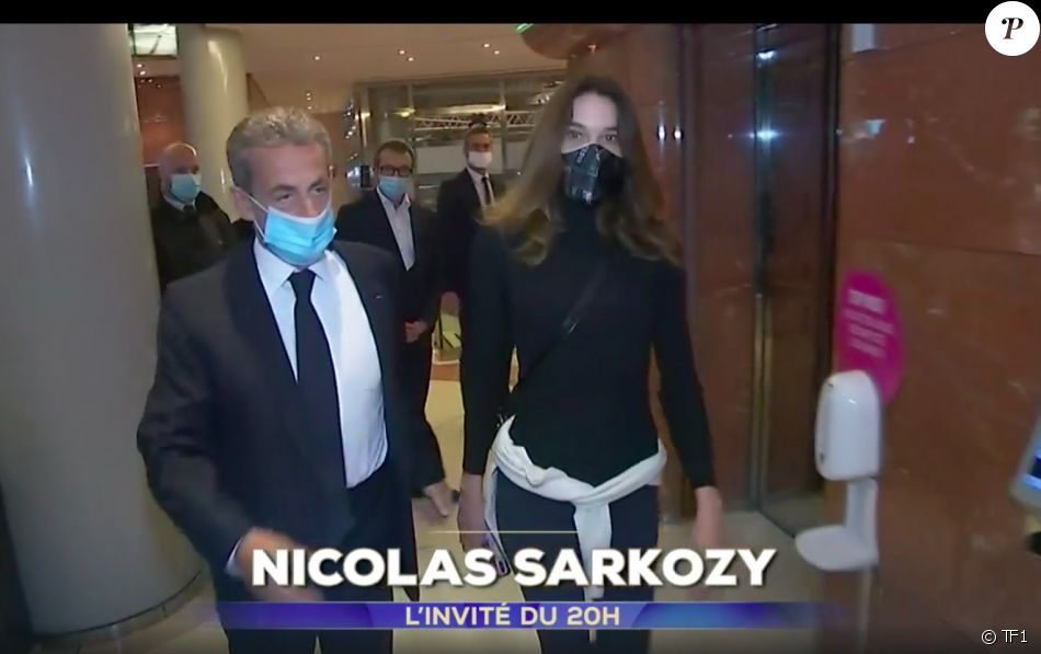 Nicolas Sarkozy accompagné par son épouse Carla Bruni-Sarkozy dans les locaux de TF1, avant le JT de 20H.