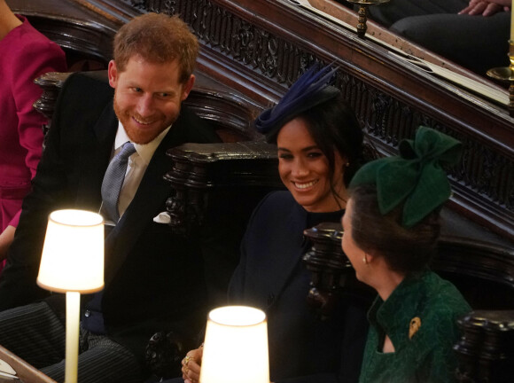Le prince Harry, duc de Sussex, Meghan Markle, duchesse de Sussex et la princesse Anne à la cérémonie de mariage de la princesse Eugenie d'York et Jack Brooksbank en la chapelle Saint-George au château de Windsor, Royaume Uni, le 12 octobre 2018.