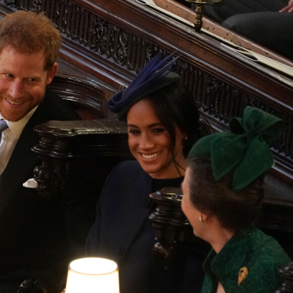 Le prince Harry, duc de Sussex, Meghan Markle, duchesse de Sussex et la princesse Anne à la cérémonie de mariage de la princesse Eugenie d'York et Jack Brooksbank en la chapelle Saint-George au château de Windsor, Royaume Uni, le 12 octobre 2018.