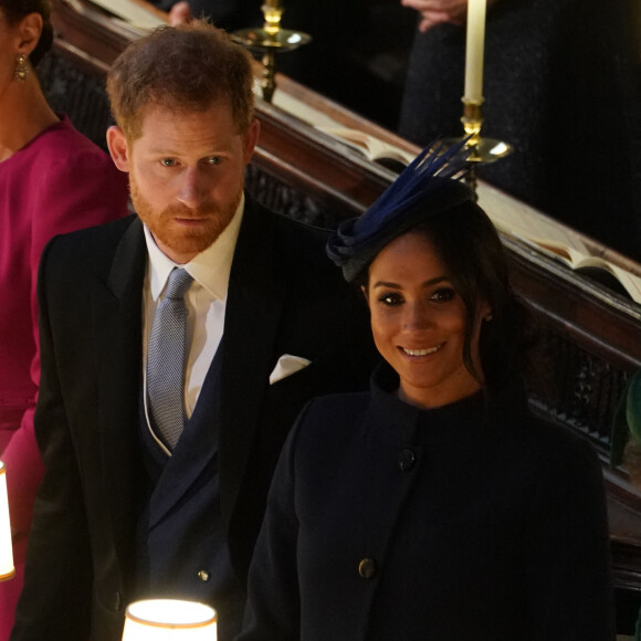 Le prince Harry, duc de Sussex, et Meghan Markle, duchesse de Sussex à la cérémonie de mariage de la princesse Eugenie d'York et Jack Brooksbank en la chapelle Saint-George au château de Windsor, Royaume Uni, le 12 octobre 2018.