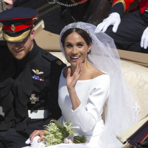 Le prince Harry et Meghan Markle en calèche après la cérémonie de leur mariage au château de Windsor. Royaume Uni, le 19 mai 2018.