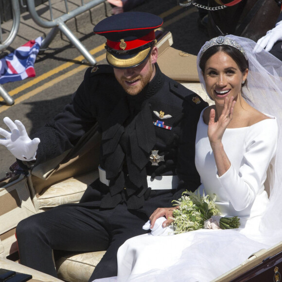 Le prince Harry et Meghan Markle en calèche après la cérémonie de leur mariage au château de Windsor. Royaume Uni, le 19 mai 2018.