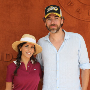 Reem Kherici et son mari Gilles Lemaire passent au village des Internationaux de France de Roland-Garros, avant le match de Rafael Nadal et David Schwartzman. © Dominique Jacovides / Bestimage