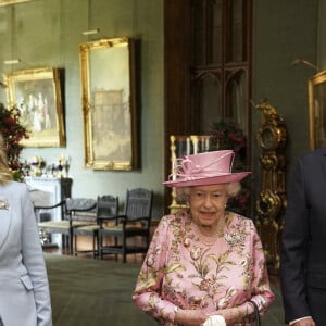 Le président des Etats-Unis Joe Biden et sa femme Jill Biden visitent le château de Windsor en compagnie de la reine Elizabeth II, le 13 juin 2021. 