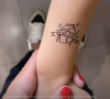 Laure Manaudou dévoile un petit tatouage temporaire fait sur son fils, le mercredi 14 avril 2021.