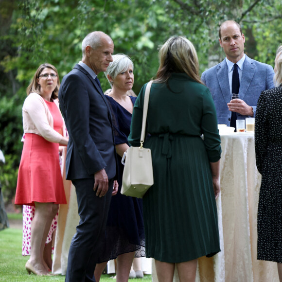 Le prince William, duc de Cambridge, célèbre le 73 ème anniversaire du National Health Service à Buckingham Palace à Londres et reçoit des membres du personnel soignant britannique, le 5 juillet 2021.