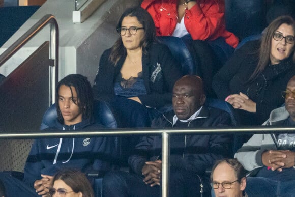 Wilfried Mbappé, Fayza Lamari, Ethan Mbappé - People au Match de Ligue de champions Psg (3) - Leipzig (2) au Parc des Princes à Paris le 19 octobre 2021. © Cyril Moreau/Bestimage