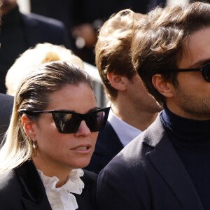 Sophie Tapie et son mari Jean-Mathieu Marinetti - Sorties de la messe funéraire en hommage à Bernard Tapie en l'église Saint-Germain-des-Prés à Paris. Le 6 octobre 2021. © Jacovides-Moreau / Bestimage