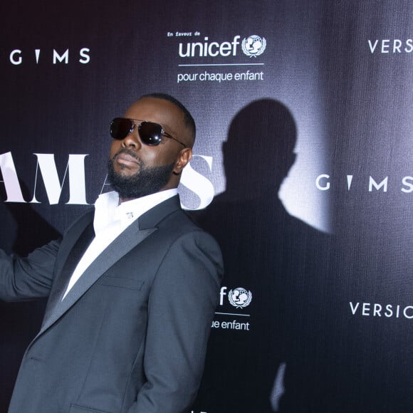 Gims au photocall de la soirée "Unis comme jamais" au profit de l'Unicef, au pavillon Cambon à Paris. Le chanteur Gims a récolté 1 500 000 € et a dévoilé au grand jour le partenariat entre la maison Audemars Piguet et l'artiste ainsi que sa volonté d'aider les enfants en Afrique. © Pierre Perusseau / Bestimage 