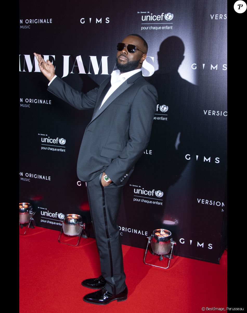 Gims au photocall de la soirée "Unis comme jamais" au profit de l'Unicef, au pavillon Cambon à Paris. Le chanteur Gims a récolté 1 500 000 € et a dévoilé au grand jour le partenariat entre la maison Audemars Piguet et l'artiste ainsi que sa volonté d'aider les enfants en Afrique. © Pierre Perusseau / Bestimage