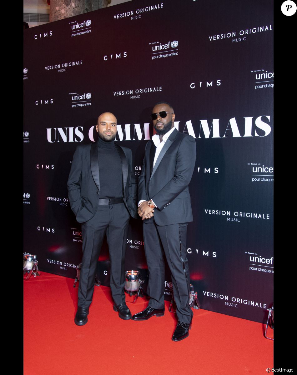 Gims et Saïd Boussif au photocall de la soirée "Unis comme jamais" au profit de l'Unicef, au pavillon Cambon à Paris. Le 8 novembre 2021. Le chanteur Gims a récolté 1 500 000 € ! Généreux comme Jamais… c’est le nom de clôture que devrait porter le gala de charité initié par l’artiste GIMS et dont tous les fonds récoltés ont été reversé à l’association Unicef France. L’évènement, organisé par Version Originale (dirigé par J.Saadia) et INDIFFERENCE PROD (S.Boussif, manager de l’artiste), a été l’occasion de dévoiler au grand jour le partenariat entre la maison Audemars Piguet et l’artiste ainsi que sa volonté d’aider les enfants en Afrique. © Pierre Perusseau / Bestimage Unicef party "Unis comme jamais" in Paris. On november 8th 2021