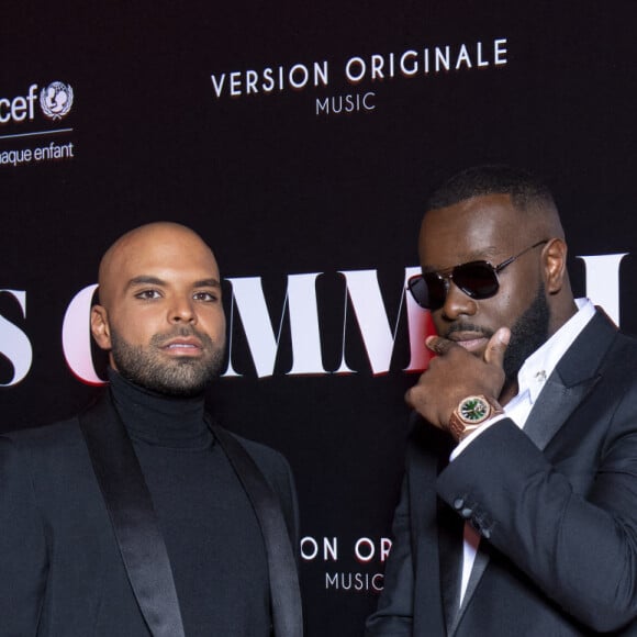 Gims et Saïd Boussif au photocall de la soirée "Unis comme jamais" au profit de l'Unicef, au pavillon Cambon à Paris. Le 8 novembre 2021. Le chanteur Gims a récolté 1 500 000 € ! Généreux comme Jamais… c’est le nom de clôture que devrait porter le gala de charité initié par l’artiste GIMS et dont tous les fonds récoltés ont été reversé à l’association Unicef France. L’évènement, organisé par Version Originale (dirigé par J.Saadia) et INDIFFERENCE PROD (S.Boussif, manager de l’artiste), a été l’occasion de dévoiler au grand jour le partenariat entre la maison Audemars Piguet et l’artiste ainsi que sa volonté d’aider les enfants en Afrique. © Pierre Perusseau / Bestimage  Unicef party "Unis comme jamais" in Paris. On november 8th 2021 