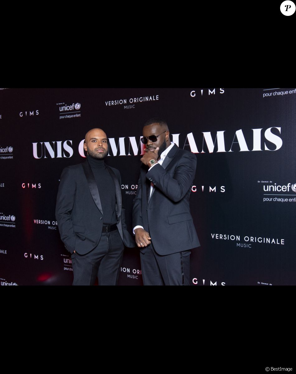 Gims et Saïd Boussif au photocall de la soirée "Unis comme jamais" au profit de l'Unicef, au pavillon Cambon à Paris. Le 8 novembre 2021. Le chanteur Gims a récolté 1 500 000 € ! Généreux comme Jamais… c’est le nom de clôture que devrait porter le gala de charité initié par l’artiste GIMS et dont tous les fonds récoltés ont été reversé à l’association Unicef France. L’évènement, organisé par Version Originale (dirigé par J.Saadia) et INDIFFERENCE PROD (S.Boussif, manager de l’artiste), a été l’occasion de dévoiler au grand jour le partenariat entre la maison Audemars Piguet et l’artiste ainsi que sa volonté d’aider les enfants en Afrique. © Pierre Perusseau / Bestimage Unicef party "Unis comme jamais" in Paris. On november 8th 2021