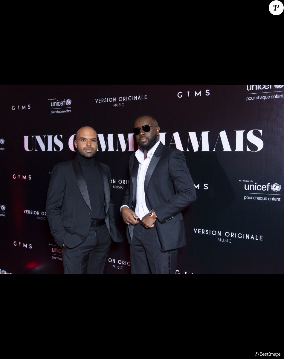 Gims et Saïd Boussif au photocall de la soirée "Unis comme jamais" au profit de l'Unicef, au pavillon Cambon à Paris. Le 8 novembre 2021. Le chanteur Gims a récolté 1 500 000 € ! Généreux comme Jamais… c’est le nom de clôture que devrait porter le gala de charité initié par l’artiste GIMS et dont tous les fonds récoltés ont été reversé à l’association Unicef France. L’évènement, organisé par Version Originale (dirigé par J.Saadia) et INDIFFERENCE PROD (S.Boussif, manager de l’artiste), a été l’occasion de dévoiler au grand jour le partenariat entre la maison Audemars Piguet et l’artiste ainsi que sa volonté d’aider les enfants en Afrique. © Pierre Perusseau / Bestimage Unicef party "Unis comme jamais" in Paris. On november 8th 2021