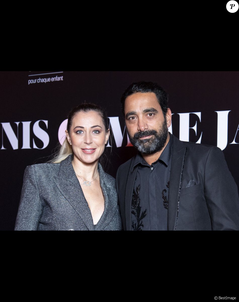 Magali Berdah et son mari Stéphane Teboul au photocall de la soirée "Unis comme jamais" au profit de l'Unicef, au pavillon Cambon à Paris. Le 8 novembre 2021. Le chanteur Gims a récolté 1 500 000 € ! Généreux comme Jamais… c’est le nom de clôture que devrait porter le gala de charité initié par l’artiste GIMS et dont tous les fonds récoltés ont été reversé à l’association Unicef France. L’évènement, organisé par Version Originale (dirigé par J.Saadia) et INDIFFERENCE PROD (S.Boussif, manager de l’artiste), a été l’occasion de dévoiler au grand jour le partenariat entre la maison Audemars Piguet et l’artiste ainsi que sa volonté d’aider les enfants en Afrique. © Pierre Perusseau / Bestimage Unicef party "Unis comme jamais" in Paris. On november 8th 2021