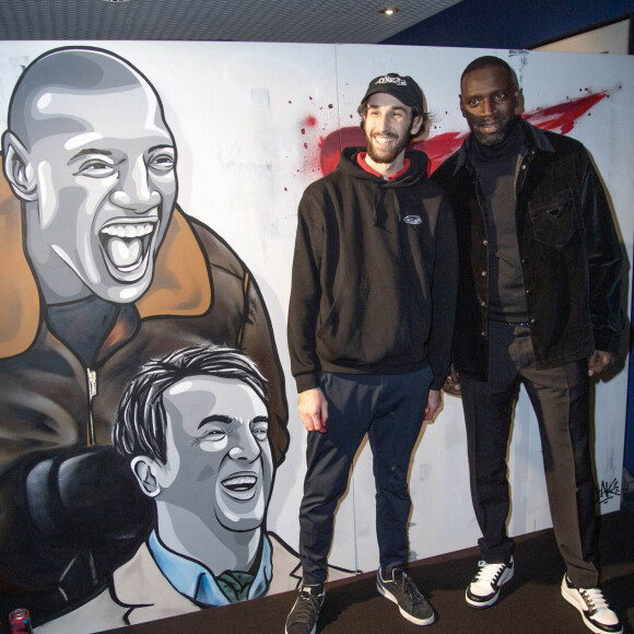 Omar Sy et l'artiste Claks One - 10e anniversaire du film "Intouchables" au cinéma UGC Normandie de Paris. Le 15 novembre 2021. @ Aurore Marechal/ABACAPRESS.COM
