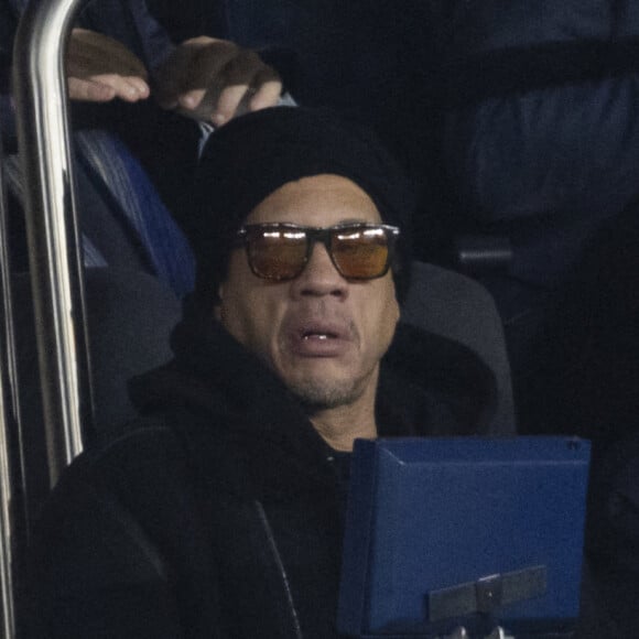 Joey Starr et son fils - People au match de Ligue 1 Uber Eats "PSG contre Monaco (2-0)" au Parc des Princes à Paris le 12 décembre 2021. © Cyril Moreau/Bestimage