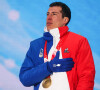Quentin Fillon Maillet remporte la médaille d'or à l'épreuve de la course contre la montre du biathlon aux Jeux Olympiques d'hiver de Pékin. Le 14 février 2022.