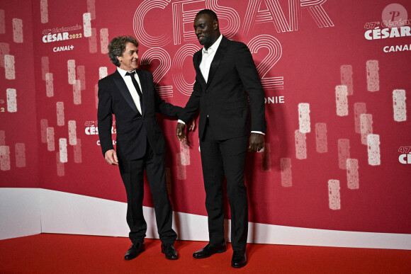 Omar Sy et François Cluzet - Photocall de la 47ème édition de la cérémonie des César à l'Olympia à Paris, le 25 février 2022. © JB Autissier/Panoramic/Bestimage 