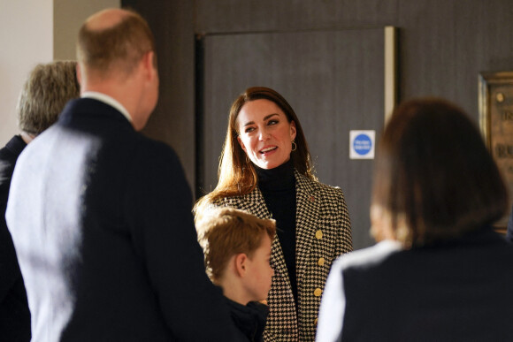 Le prince William, duc de Cambridge, et Catherine (Kate) Middleton, duchesse de Cambridge, accompagnés du prince George de Cambridge, viennent assister au match de rugby Angleterre-Pays de Galles (23-19) le 26 février 2022. 