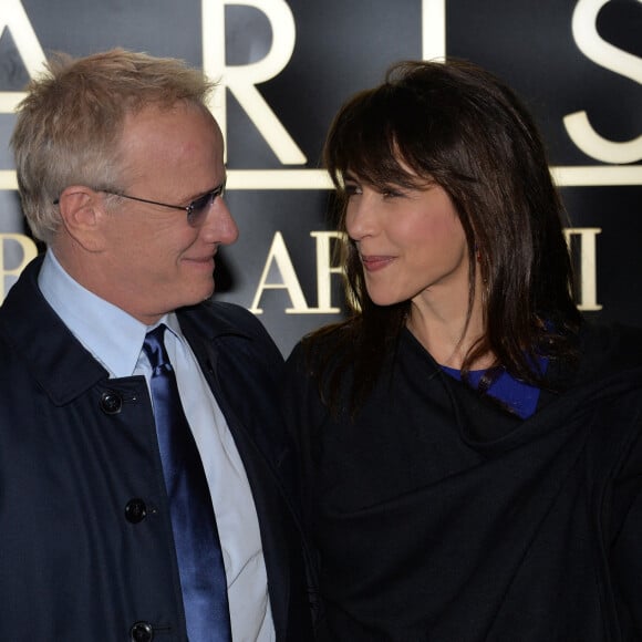 Sophie Marceau et son compagnon Christophe Lambert - Arrivee des people au defile Giorgio Armani Haute Couture Printemps/Ete 2014 au Palais de Tokyo a Paris, le 21 janvier 2014. 