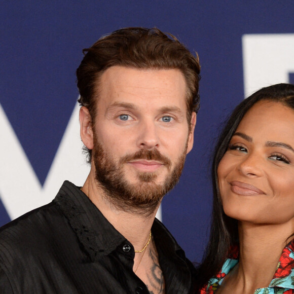 Christina Milian et son mari Matt Pokora au photocall de la première du film "Ambulance" à Los Angeles le 4 avril 2022. 