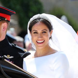 Le prince Harry, duc de Sussex, et Meghan Markle, duchesse de Sussex, en calèche au château de Windsor après la cérémonie de leur mariage au château de Windsor, Royaume Uni, le 19 mai 2018.