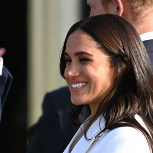 Le prince Harry, duc de Sussex, et Meghan Markle, duchesse de Sussex assistent à un engagement à la veille des Jeux Invictus 2020 aux Pays-Bas, à La Haye, le 15 avril 2022. 