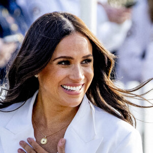 Le prince Harry, duc de Sussex, et Meghan Markle, duchesse de Sussex assistent à un engagement à la veille des Jeux Invictus 2020 aux Pays-Bas, à La Haye, le 15 avril 2022. 