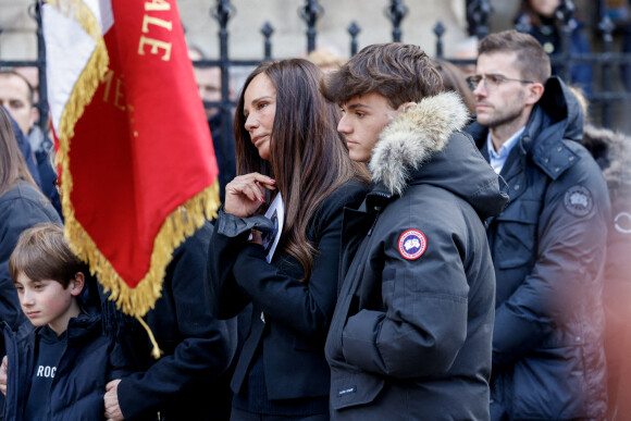 Nathalie Marquay, son fils Tom et Olivier Pernaut - La famille de Jean-Pierre Pernaut à la sortie des obsèques en la Basilique Sainte-Clotilde à Paris le 9 mars 2022. © Cyril Moreau/Bestimage