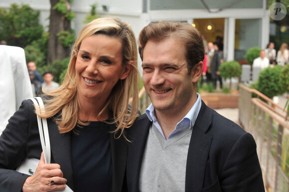 Laurence Ferrari et son mari Renaud Capuçon posant au village des Internationaux de France de tennis de Roland Garros à Paris, le 3 juin 2014. 