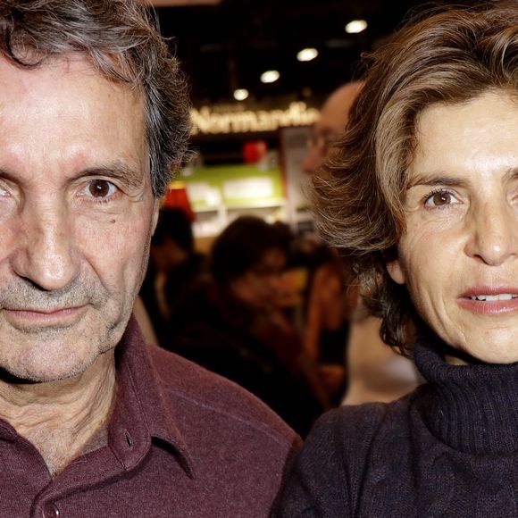Jean-Jacques Bourdin et sa femme Anne Nivat - 38ème salon du livre de Paris à la Porte de Versailles, Paris le 17 mars 2018. © Cédric Perrin/Bestimage