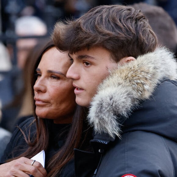 Nathalie Marquay et son fils Tom - La famille de Jean-Pierre Pernaut à la sortie des obsèques en la Basilique Sainte-Clotilde à Paris le 9 mars 2022. © Cyril Moreau/Bestimage