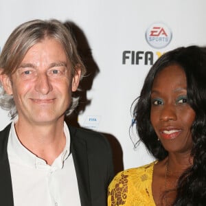 Gilles Verdez et sa compagne Fatou - Soirée de lancement du jeu vidéo "FIFA 2016" au Faust à Paris, le 21 septembre 2015.