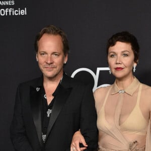 Peter Sarsgaard et Maggie Gyllenhaal - Photocall de la soirée "Chopard Loves Cinema" à l'hôtel Martinez lors du 75ème Festival International du Film de Cannes. Le 25 mai 2022 © Olivier Borde / Bestimage