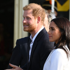 Le prince Harry, duc de Sussex, et Meghan Markle, duchesse de Sussex assistent à un engagement à la veille des Jeux Invictus 2020 aux Pays-Bas, à La Haye, le 15 avril 2022.