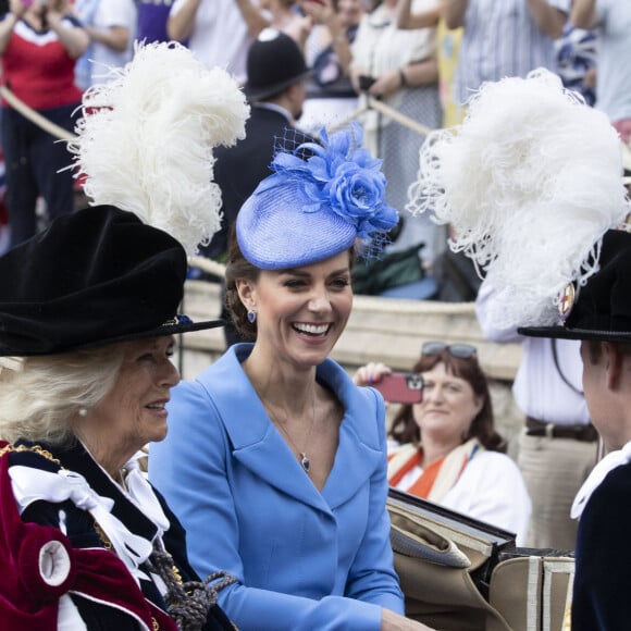 Le prince William, duc de Cambridge, et Catherine (Kate) Middleton, duchesse de Cambridge, le prince Charles, prince de Galles, et Camilla Parker Bowles, duchesse de Cornouailles, lors de la cérémonie de l'ordre de la Jarretière à la chapelle Saint-Georges du château de Windsor.  Londres, la 13 juin 2022. 