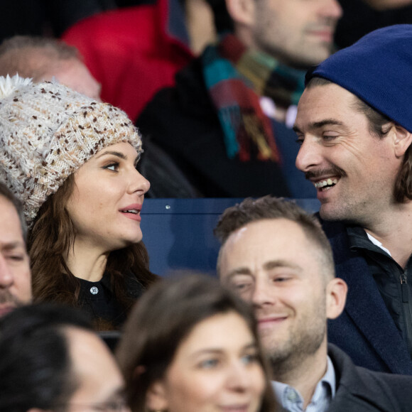 Camille Lacourt et sa compagne Alice Detollenaere dans les tribunes du Parc des Princes à Paris, le 23 février 2020. © Cyril Moreau/Bestimage