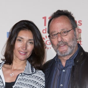 Jean Reno et sa femme Zofia Borucka - Photocall de l'exposition "120 ans de Cinéma: Depuis que le Cinéma existe" au 104 à Paris le 13 avril 2015.