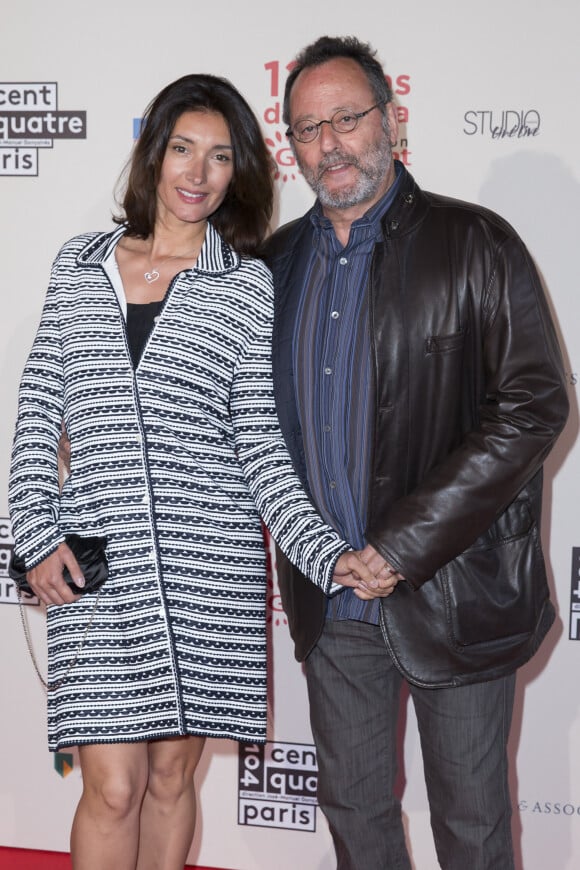 Jean Reno et sa femme Zofia Borucka - Photocall de l'exposition "120 ans de Cinéma: Depuis que le Cinéma existe" au 104 à Paris le 13 avril 2015.