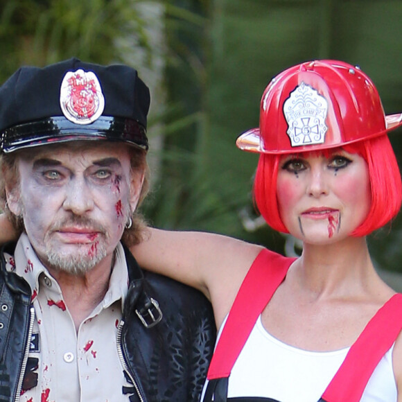 Exclusif - Laeticia Hallyday et Johnny Hallyday et leurs filles Jade et Joy se rendent a une soiree d'Halloween a Los Angeles le 31 octobre 2013. Johnny etait habille en flic zombie et laeticia en pompier zombie. Elyette, la grand mere de Leaticia faisait egalement partie de la fete. 