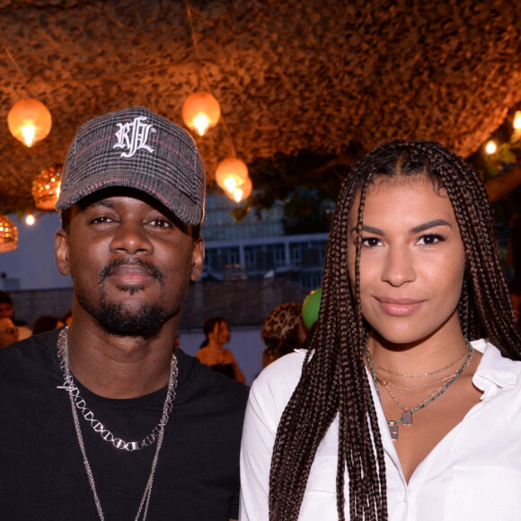 Exclusif - Black M (Alpha Diallo) et sa femme Léa Djadja lors de la soirée qui se tenait sur la terrasse éphémère "Barbanegra" à Paris, le 6 juillet 2021. © Rachid Bellak/Bestimage