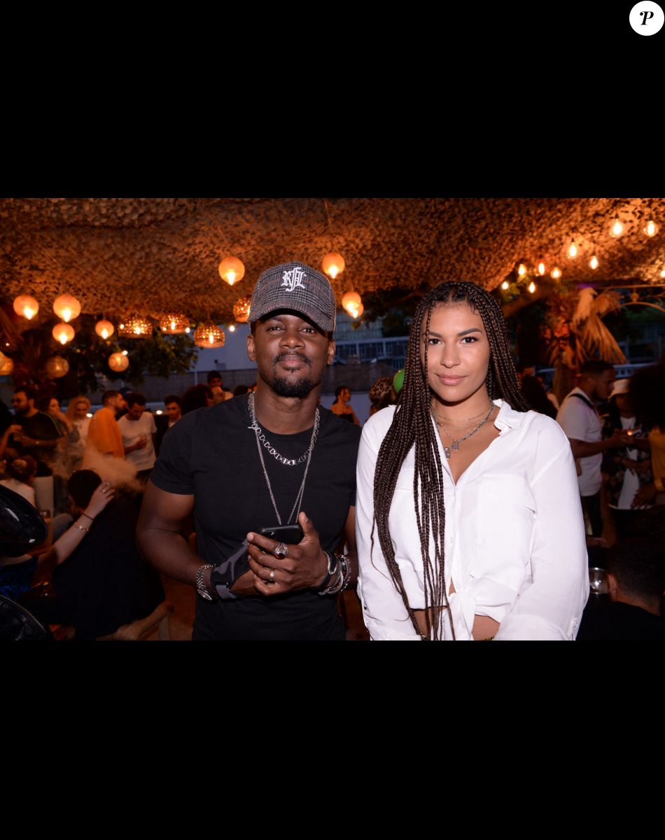 Exclusif - Black M (Alpha Diallo) et sa femme Léa Djadja lors de la soirée qui se tenait sur la terrasse éphémère "Barbanegra" à Paris, le 6 juillet 2021. © Rachid Bellak/Bestimage