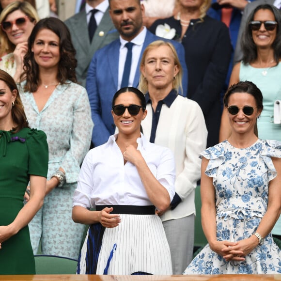 Catherine (Kate) Middleton, duchesse de Cambridge, Meghan Markle, duchesse de Sussex, et Pippa Middleton dans les tribunes lors de la finale femme de Wimbledon "Serena Williams - Simona Halep (2/6 - 2/6) à Londres, le 13 juillet 2019.